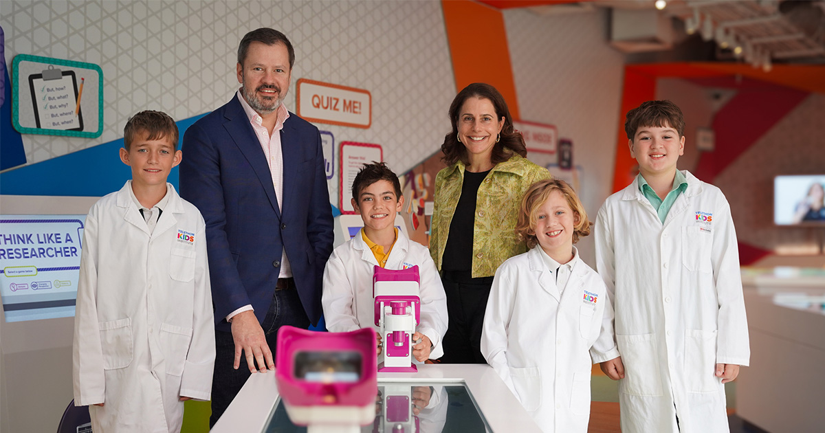 The Hon Ed Husic MP, Professor Catherine Elliott, and some kids in the Telethon Kids Discovery Centre